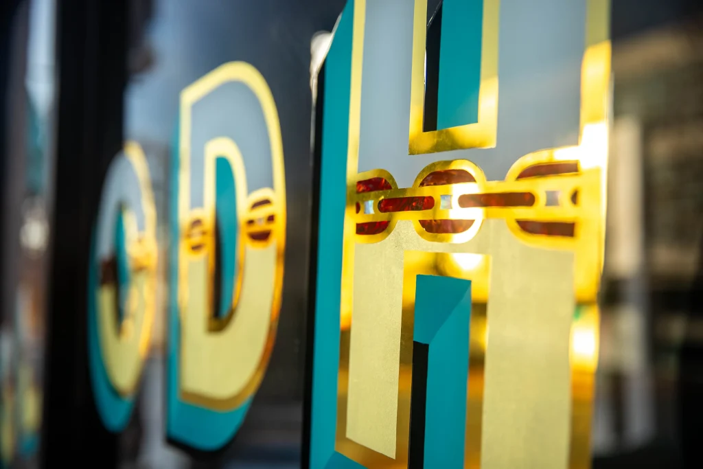 gold signage, shopfront signage, window gold lettering, gold sticker signage, window signage, gold lettering, metallic signage, colourful window signage, perth window graphics, perth window signage, business signage